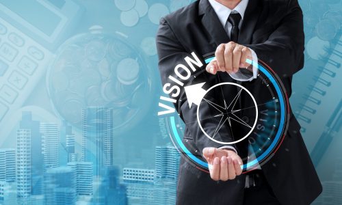 business man drive compass for vision, management concept